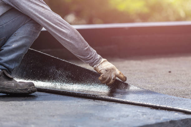 Professional Basement Waterproofing technician working in Carle Place, NY